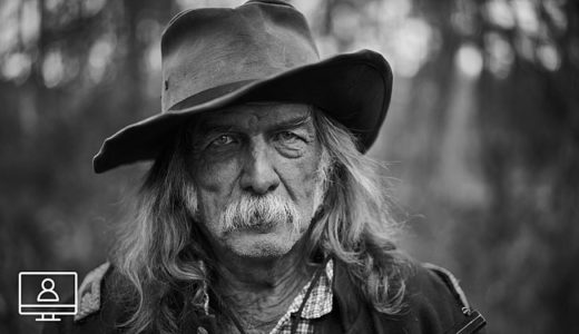 capture one webinar mastering black and white photography-headshot old man long hair oustache wearing hat